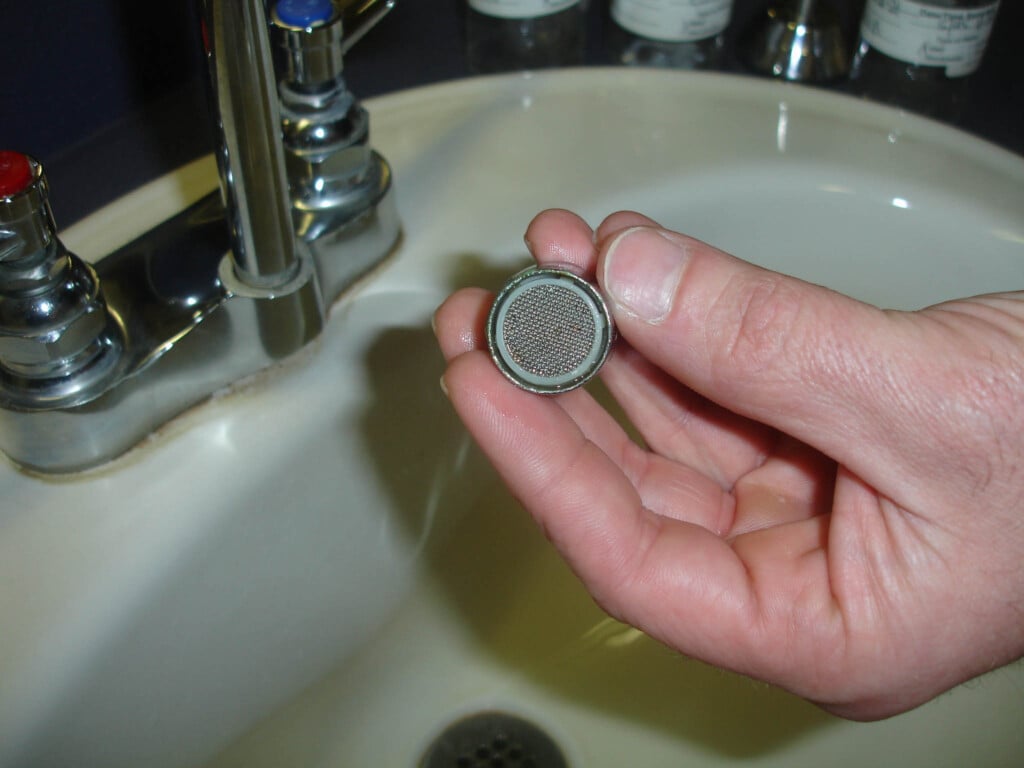 removing an aerator from a sink faucet