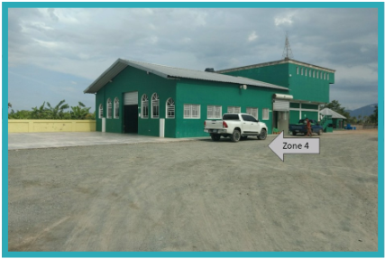 Open parking lot outside a produce processing facility.