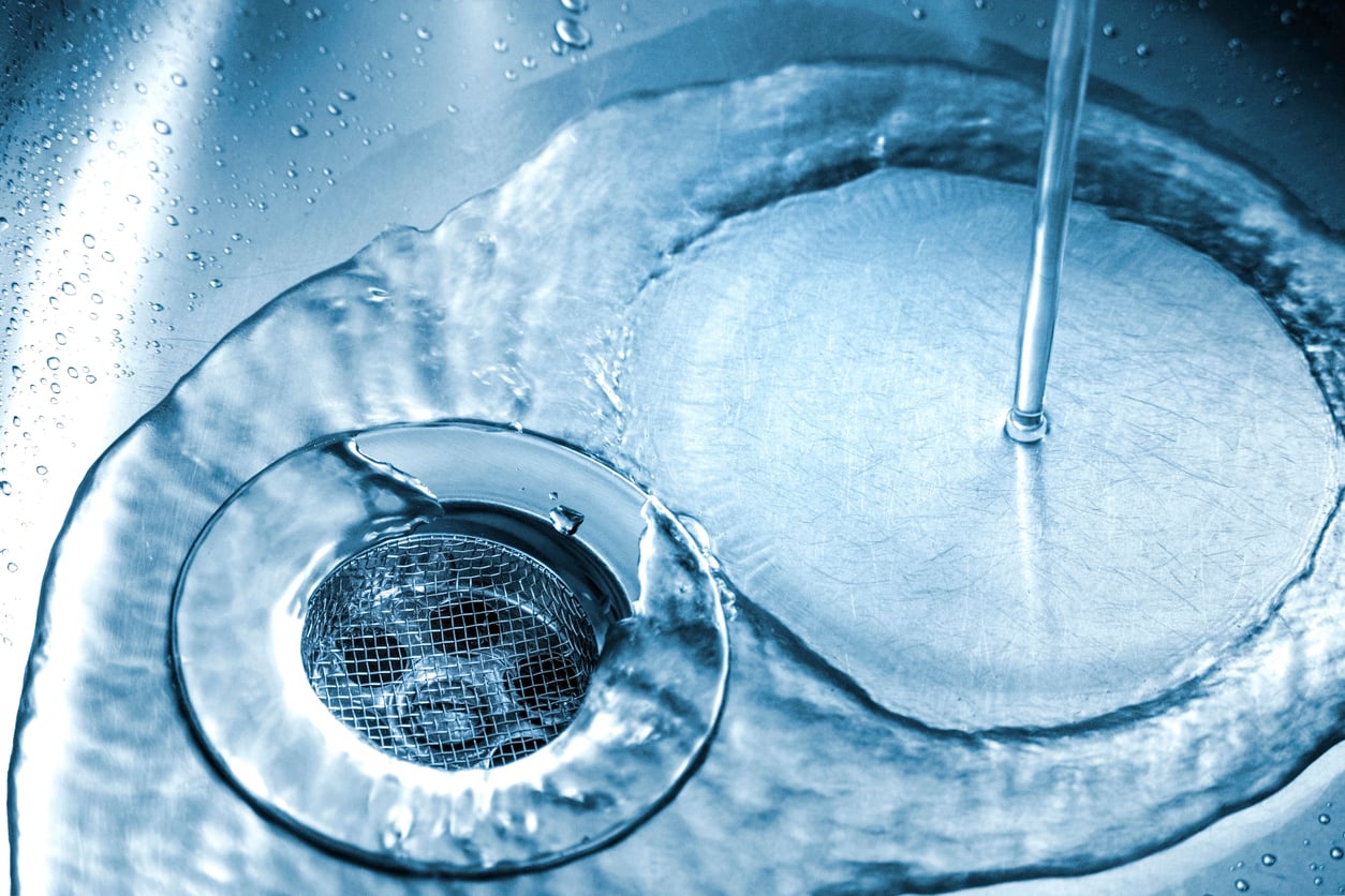 Running water in the clean kitchen sink
