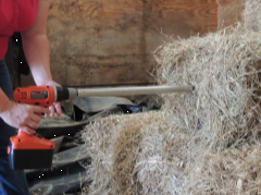 a hay probe is inserted into a bale to take a sample