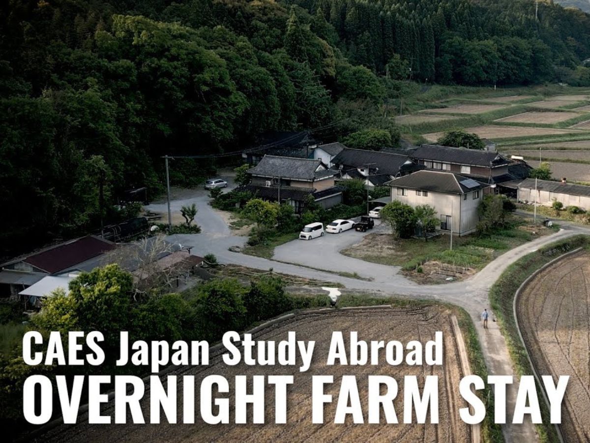 An aerial view of a Japanese farm with the words "CAES Japan study abroad: Overnight farm stay" overlayed in white.