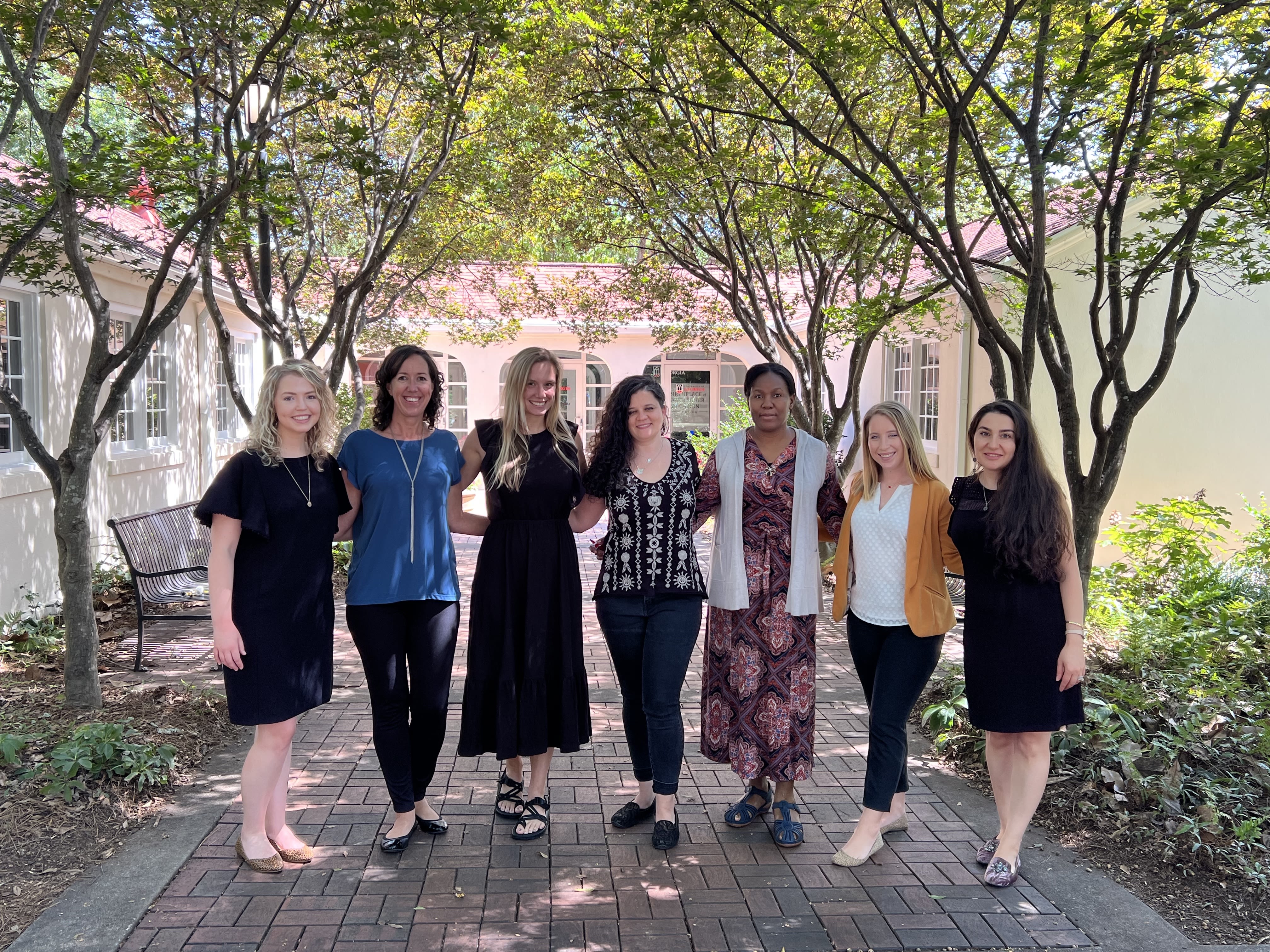 Lamm and members of her lab gather under the trees at UGA's Four Towers building