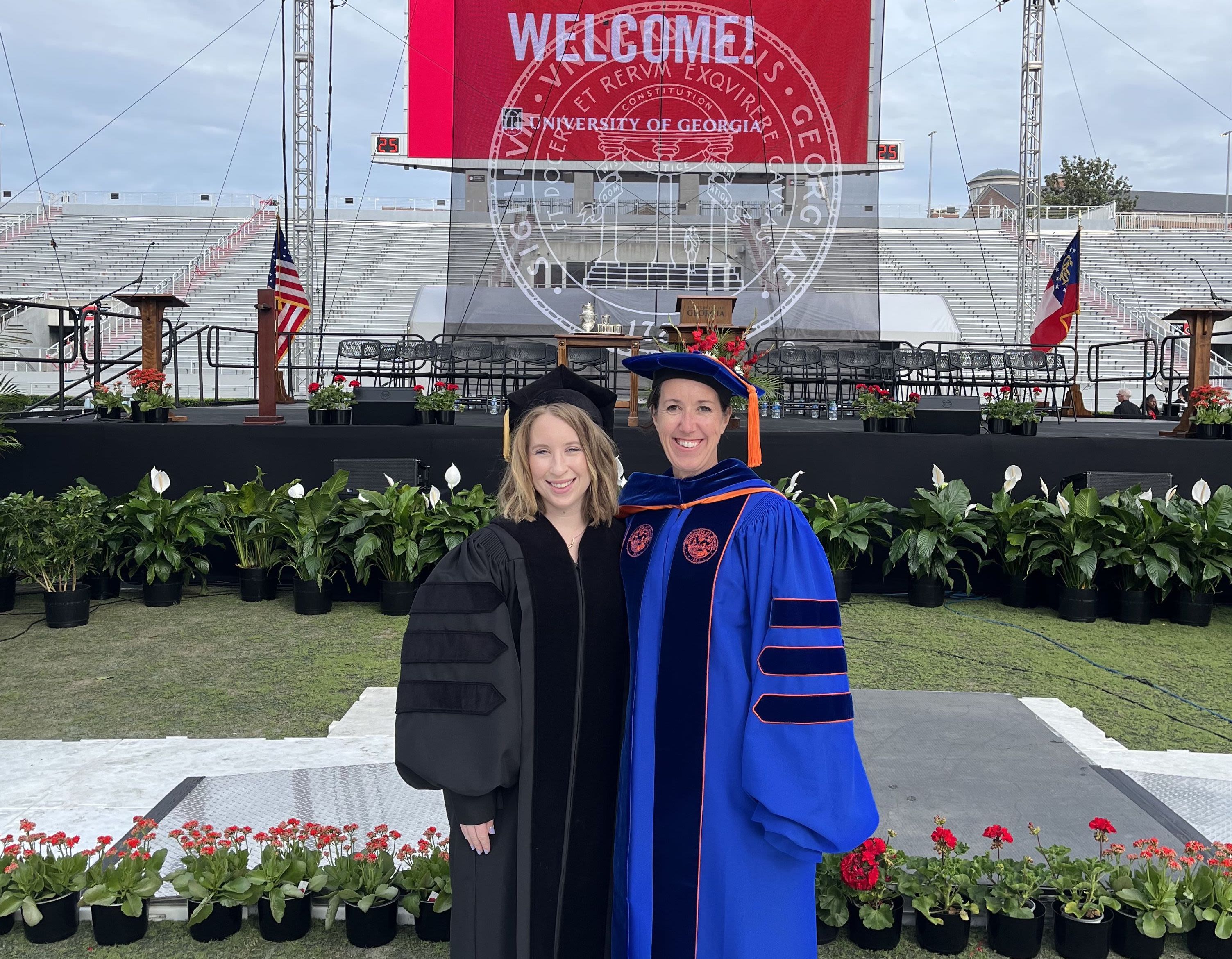Lamm and Sanders in academic regalia at UGA's Sanford Stadium