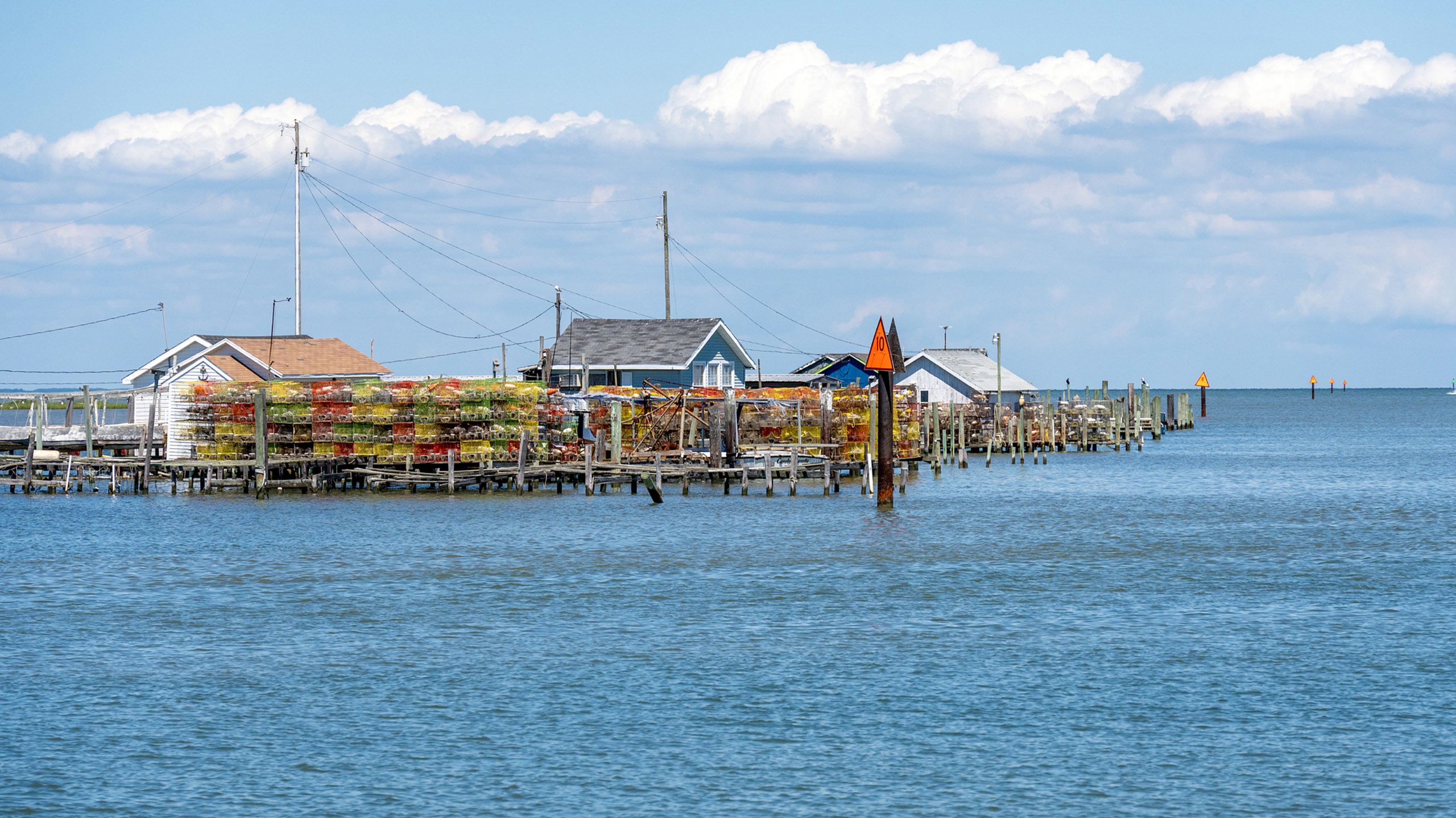 A string of structures on stilts on the waterfront