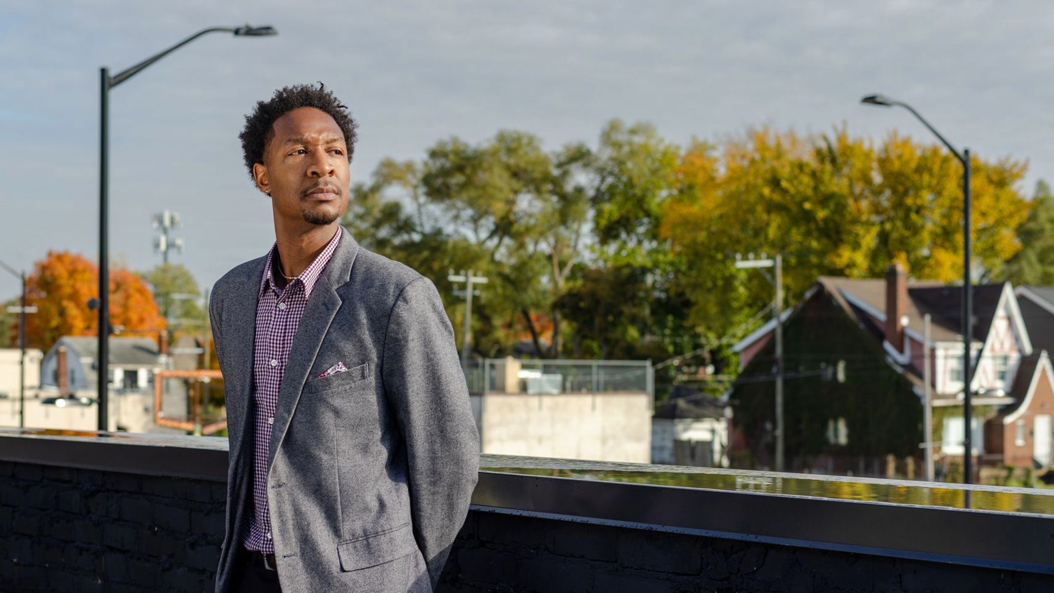 Marcus Jones on a rooftop looking out over the city