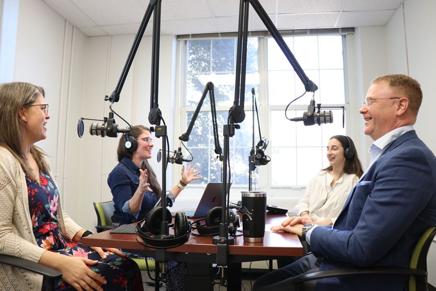 Cultivating Curiosity hosts interview a guest in the studio.