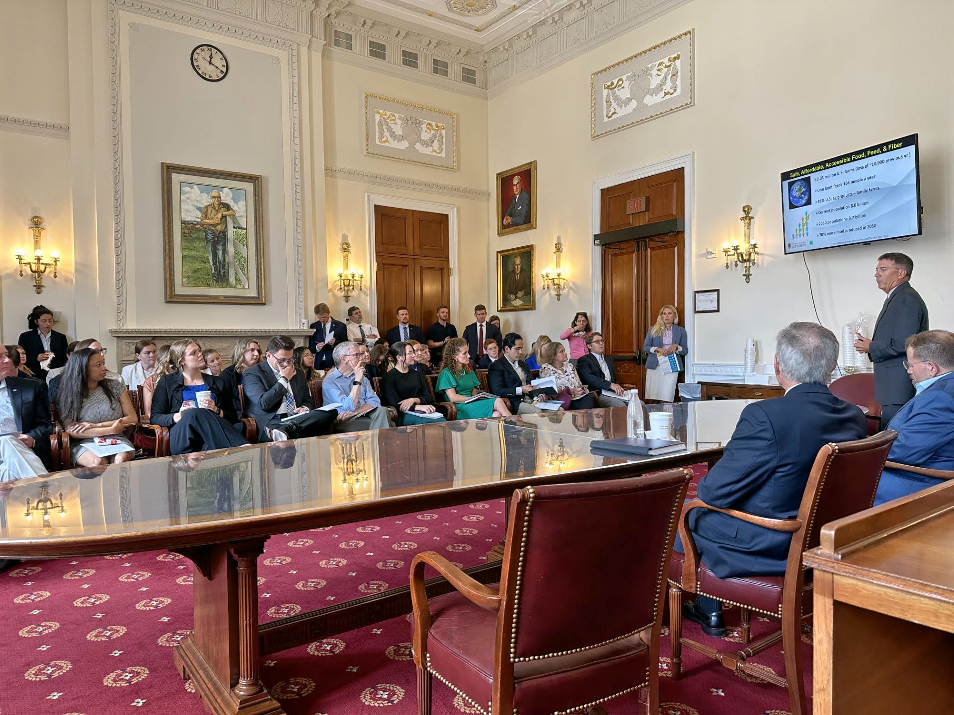 Culpepper on the far right stands as he presents research to lawmakers at a hearing in Washington D.C.