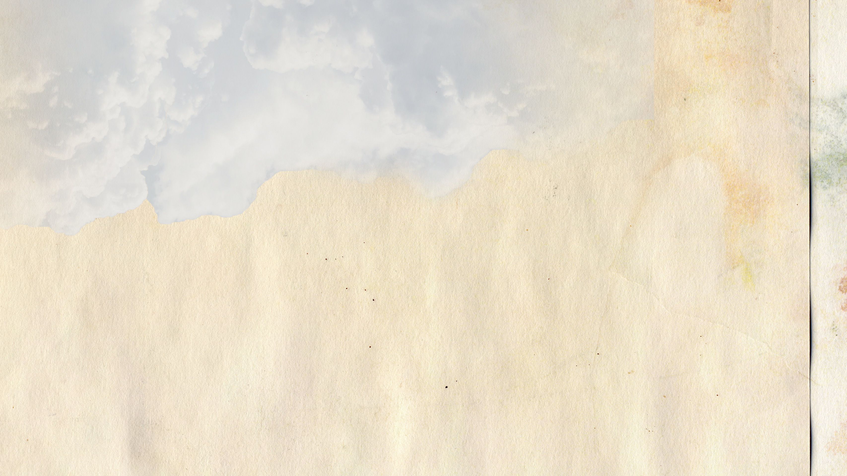 Clouds hang over a paper-textured background