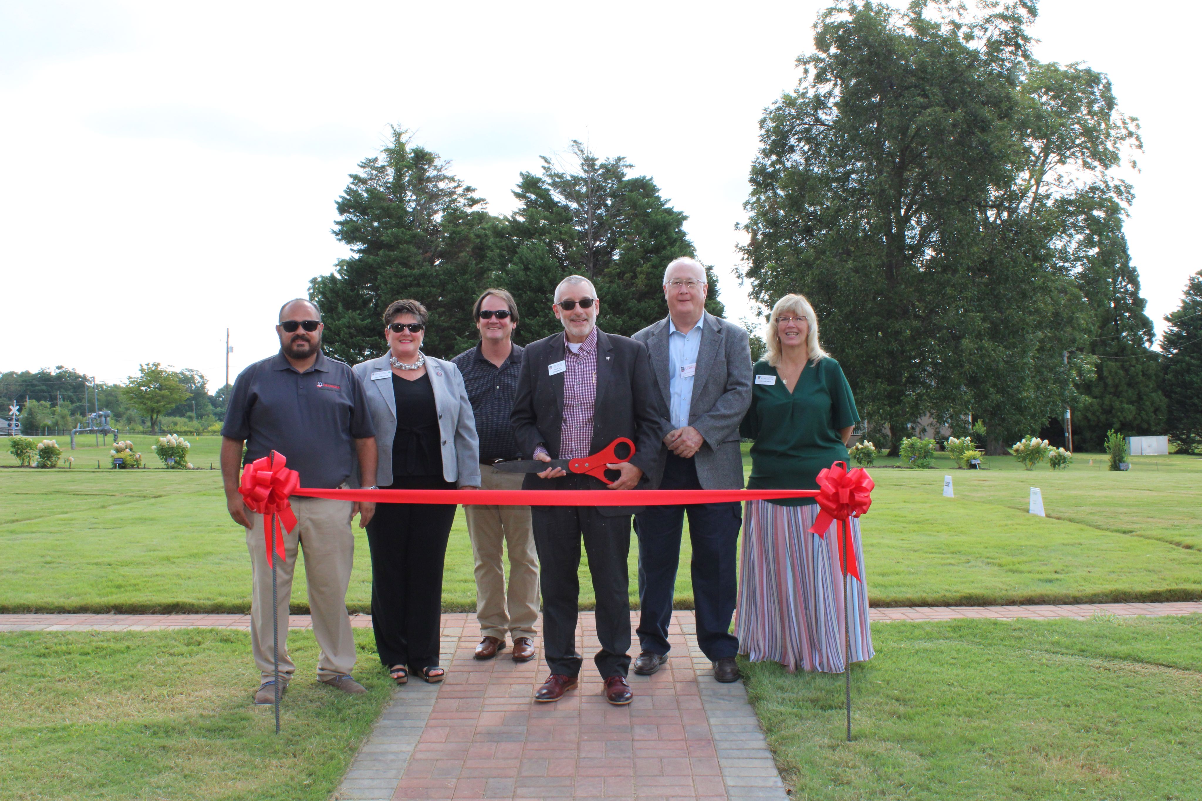 From left, Rolando Orellana, UGA Extension urban water management agent for the Center for Urban Agriculture; Laura Perry Johnson, associate dean for Extension; Dan Suiter, chair of the Urban Agriculture Commission; Nick Place, CAES dean and director; David Buntin, interim assistant provost and campus director for UGA-Griffin; and Jule-Lynne Macie, interim director of the Center for Urban Agriculture, cut the ribbon for the Irrigation Demonstration Site at UGA-Griffin.