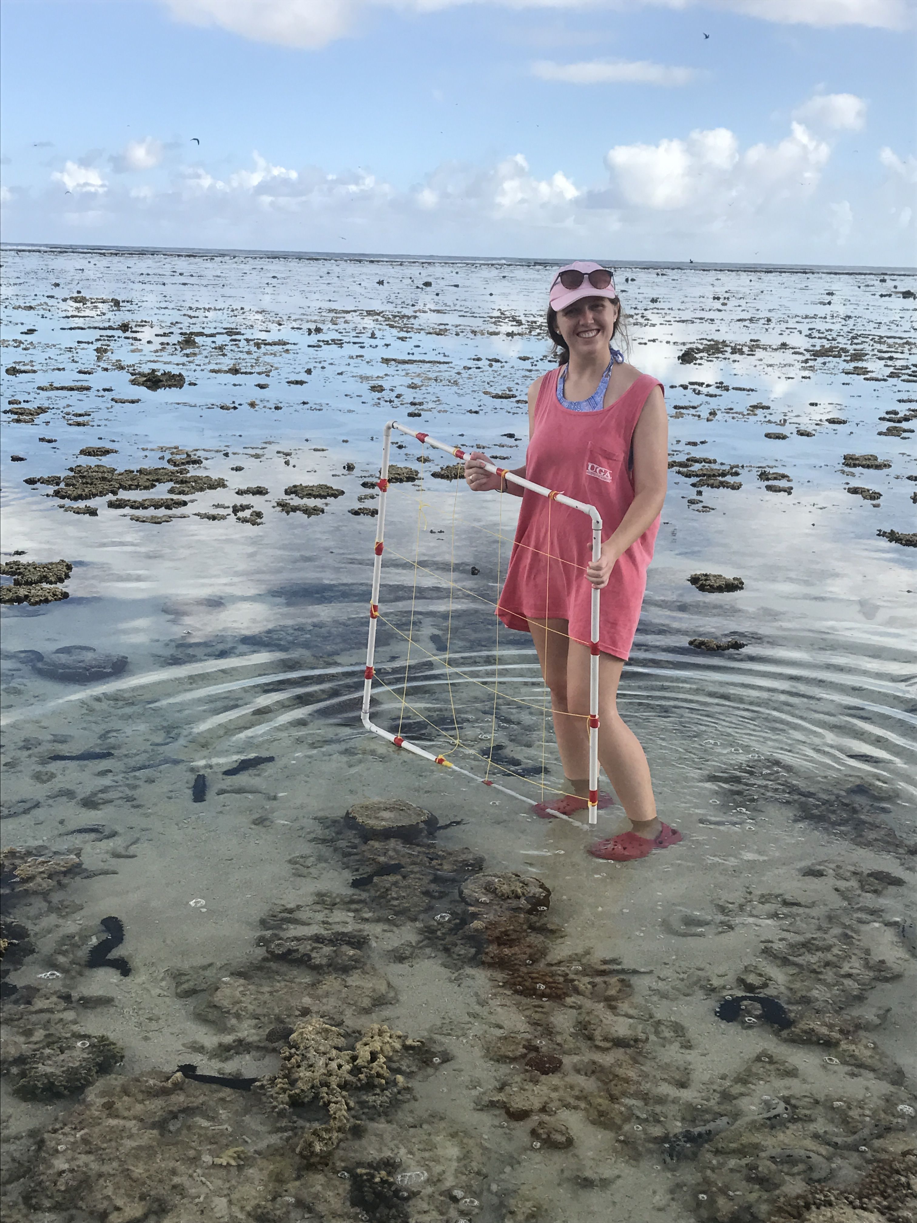 Siragusa holds a net along the coast in Australia