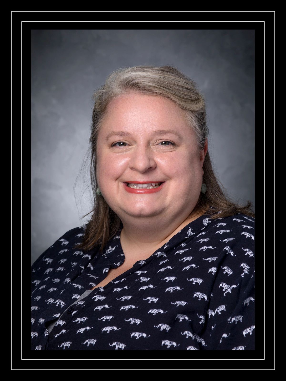 Associate Professor Faith Critzer smiles in her professional headshot