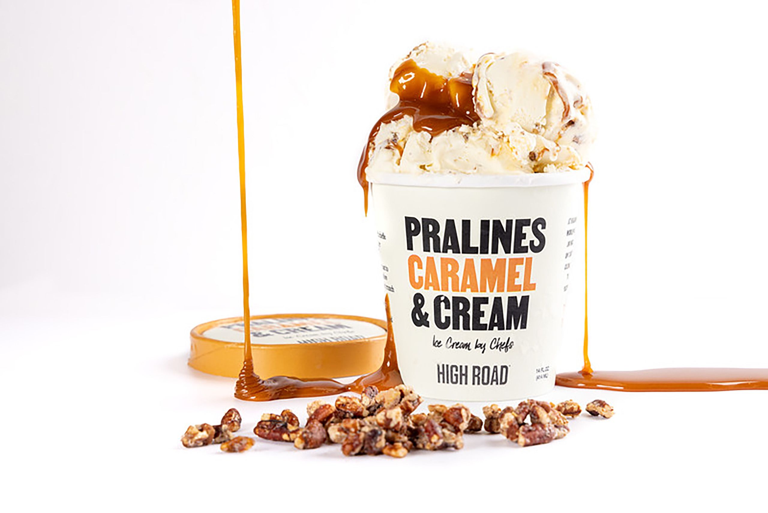 Caramel oozes off a large scoop of pralines and caramel cream ice cream