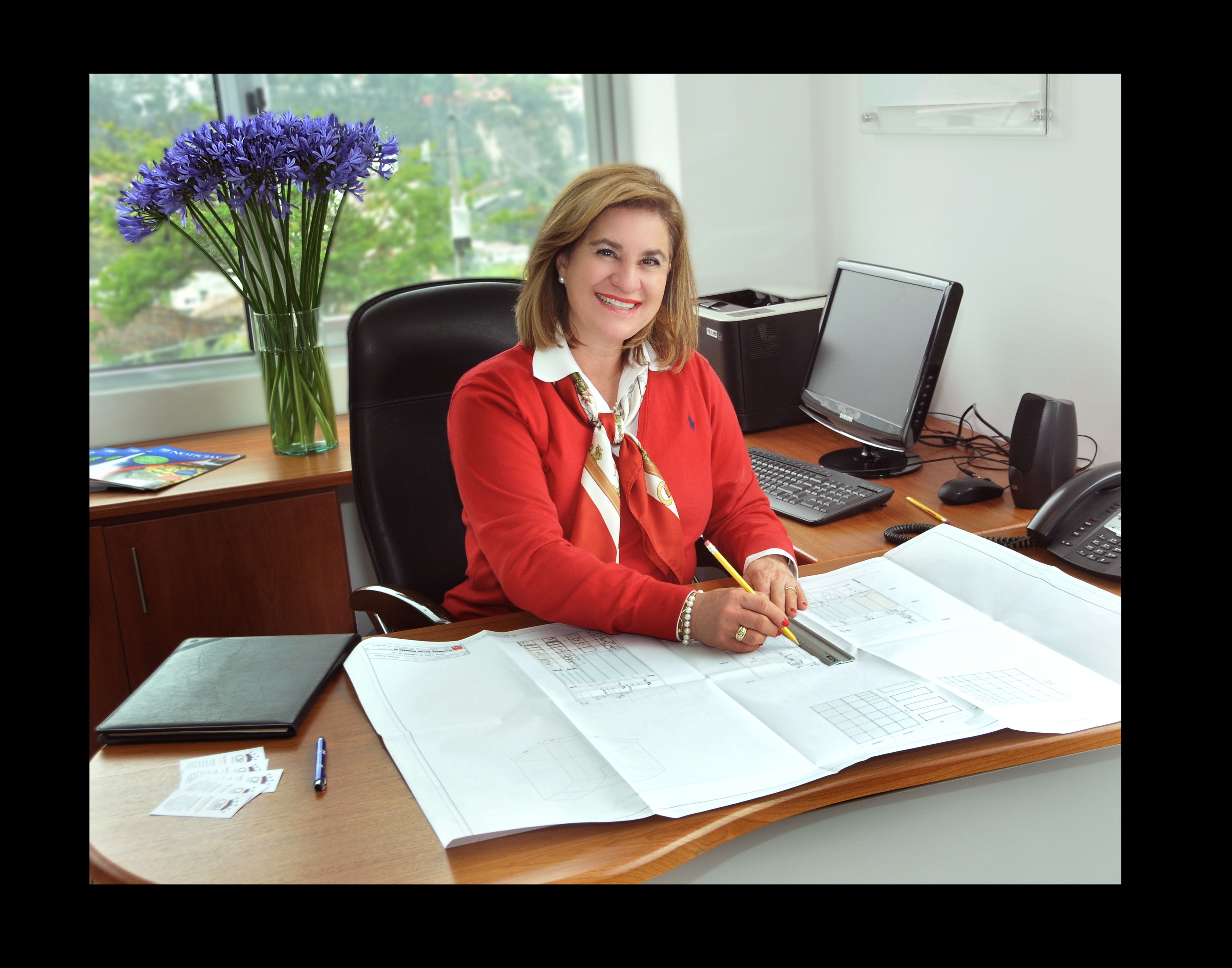 Woman sits at a desk