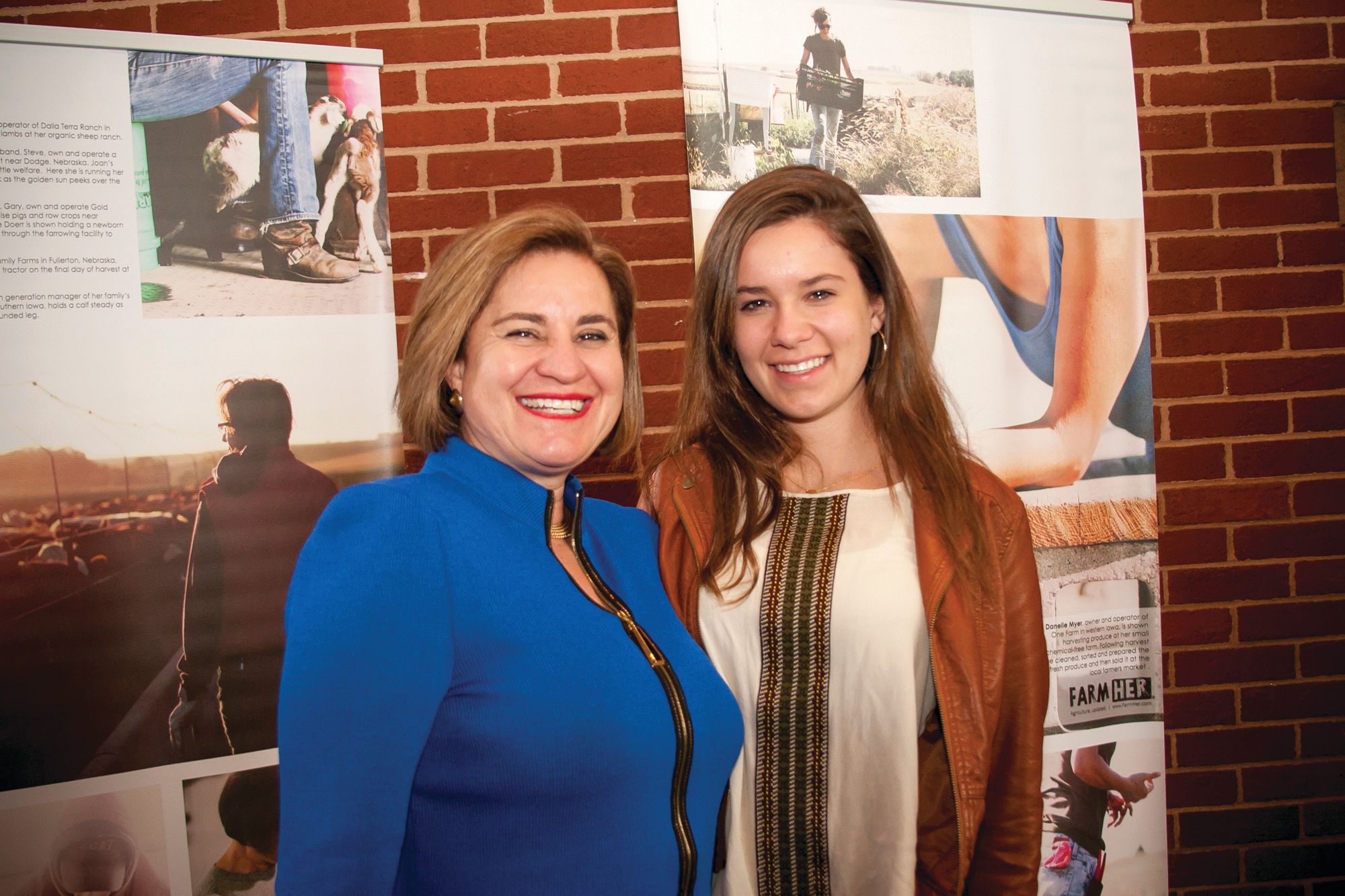 Hofland and her daughter smile as they pose for a photo together