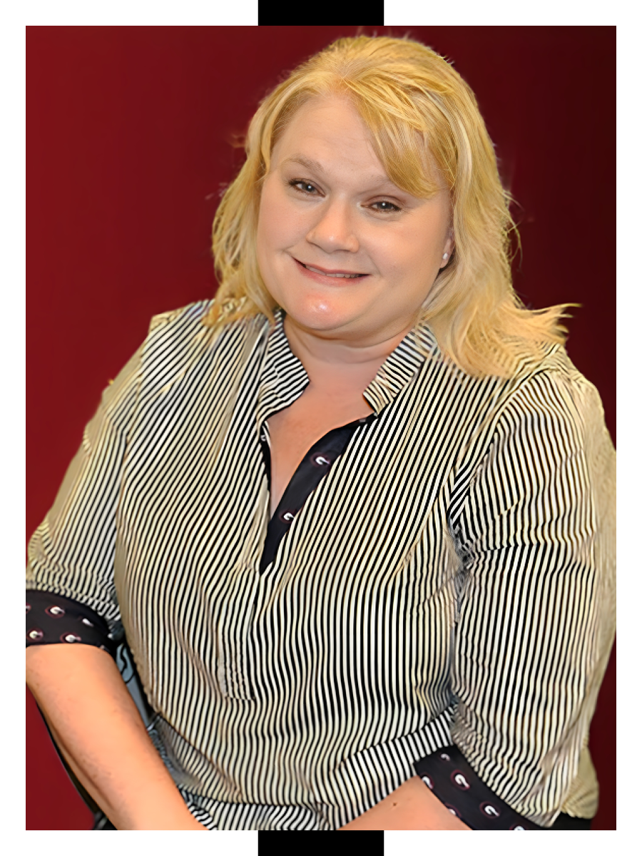 Headshot of Angela Dupree, A blonde woman in a black and white striped shirt with University of Georgia trim.