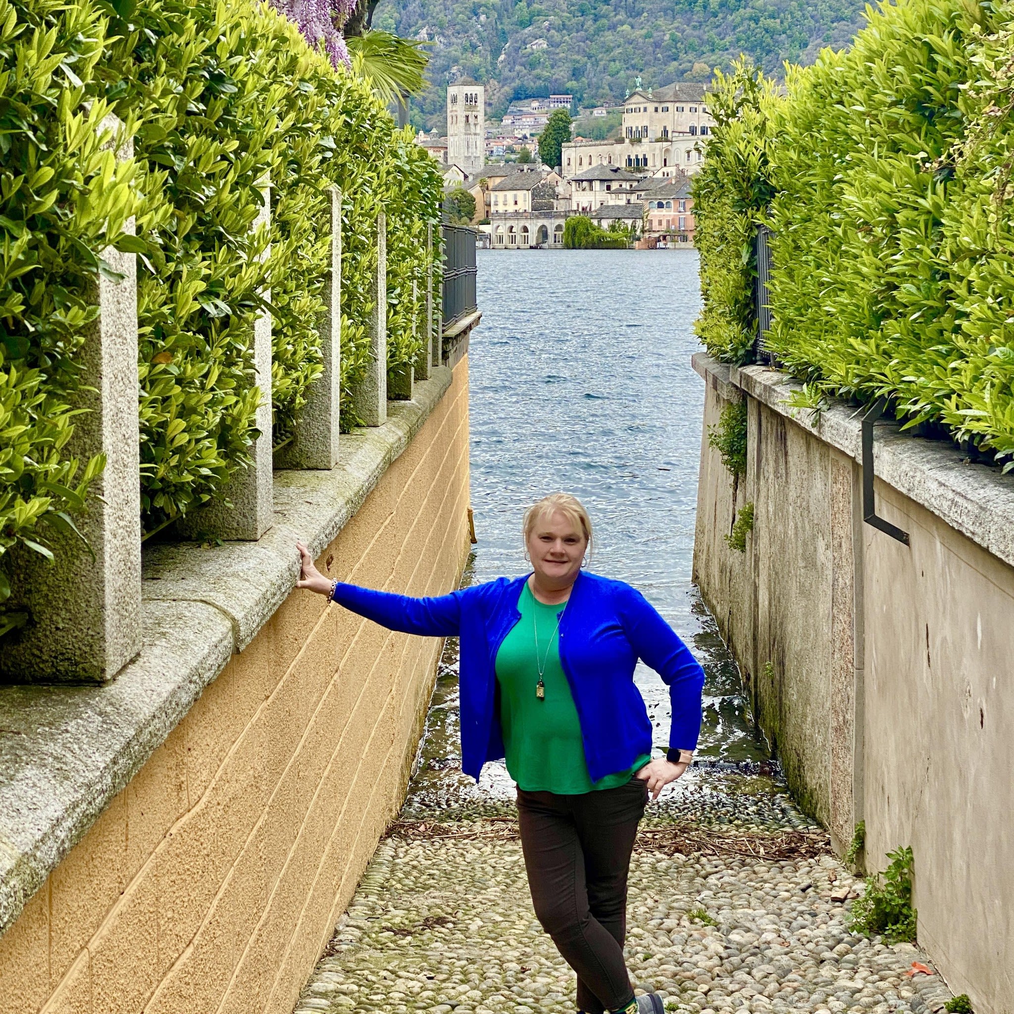 Dupree stands in front of an Italian coastline