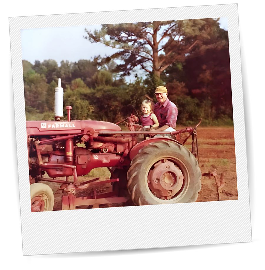 Dupree as a child with her grandfather on a tractor