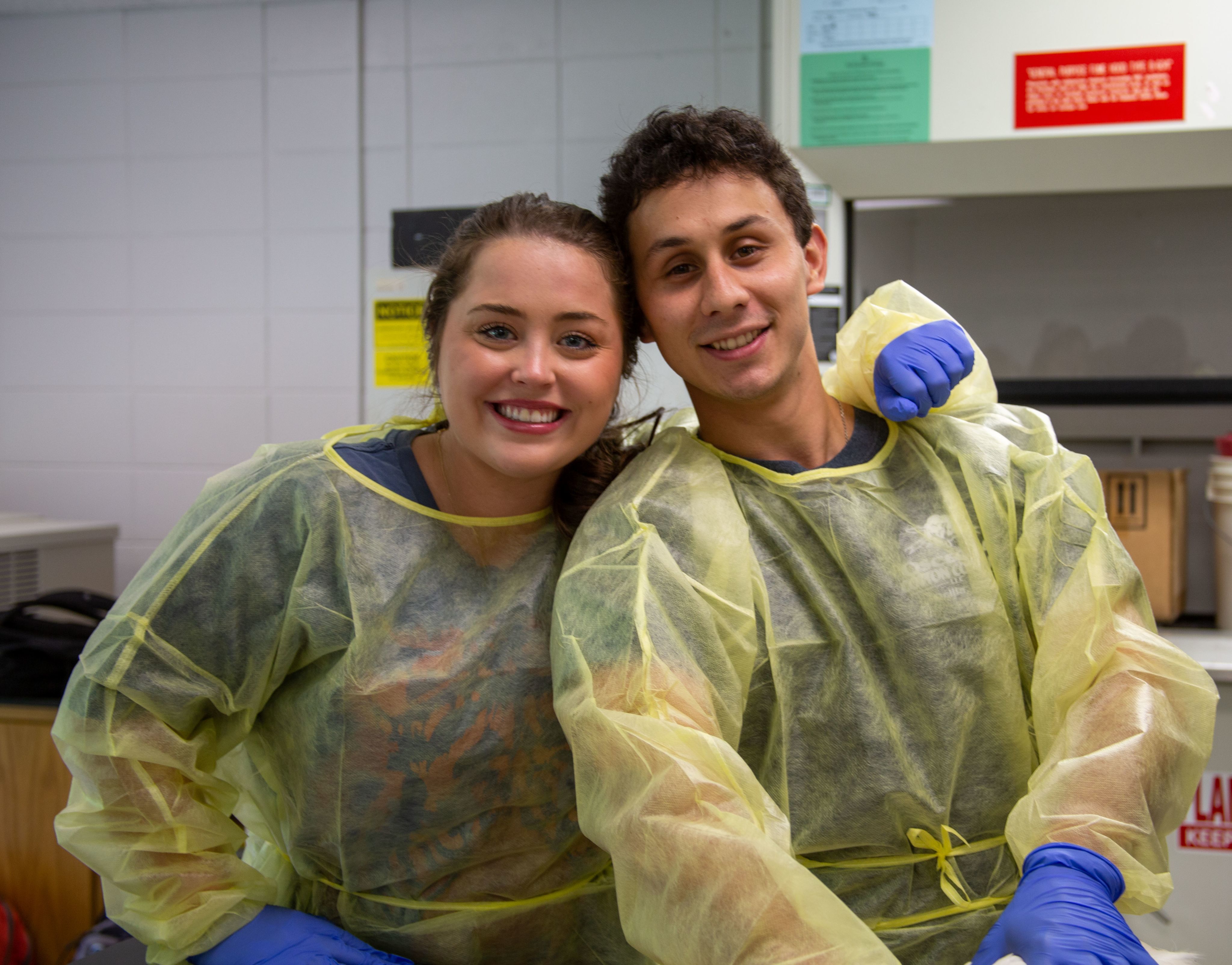 Two students pose in PPE