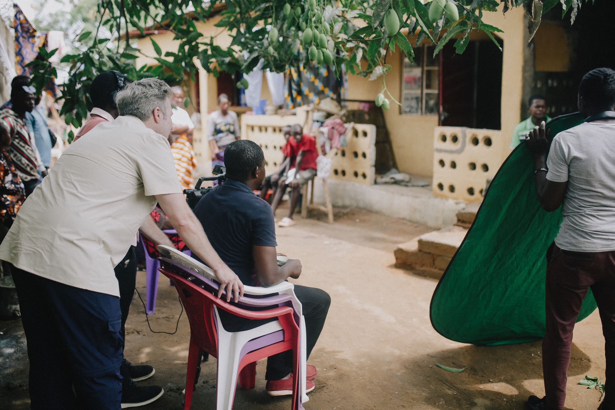 Tamlin Hall and his crew film an outdoor scene in the town of Waterloo, Sierra Leone.