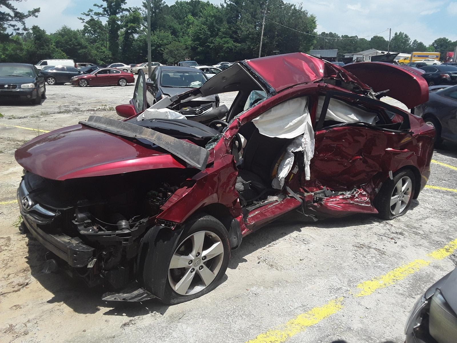 Side view of a totaled Honda sedan