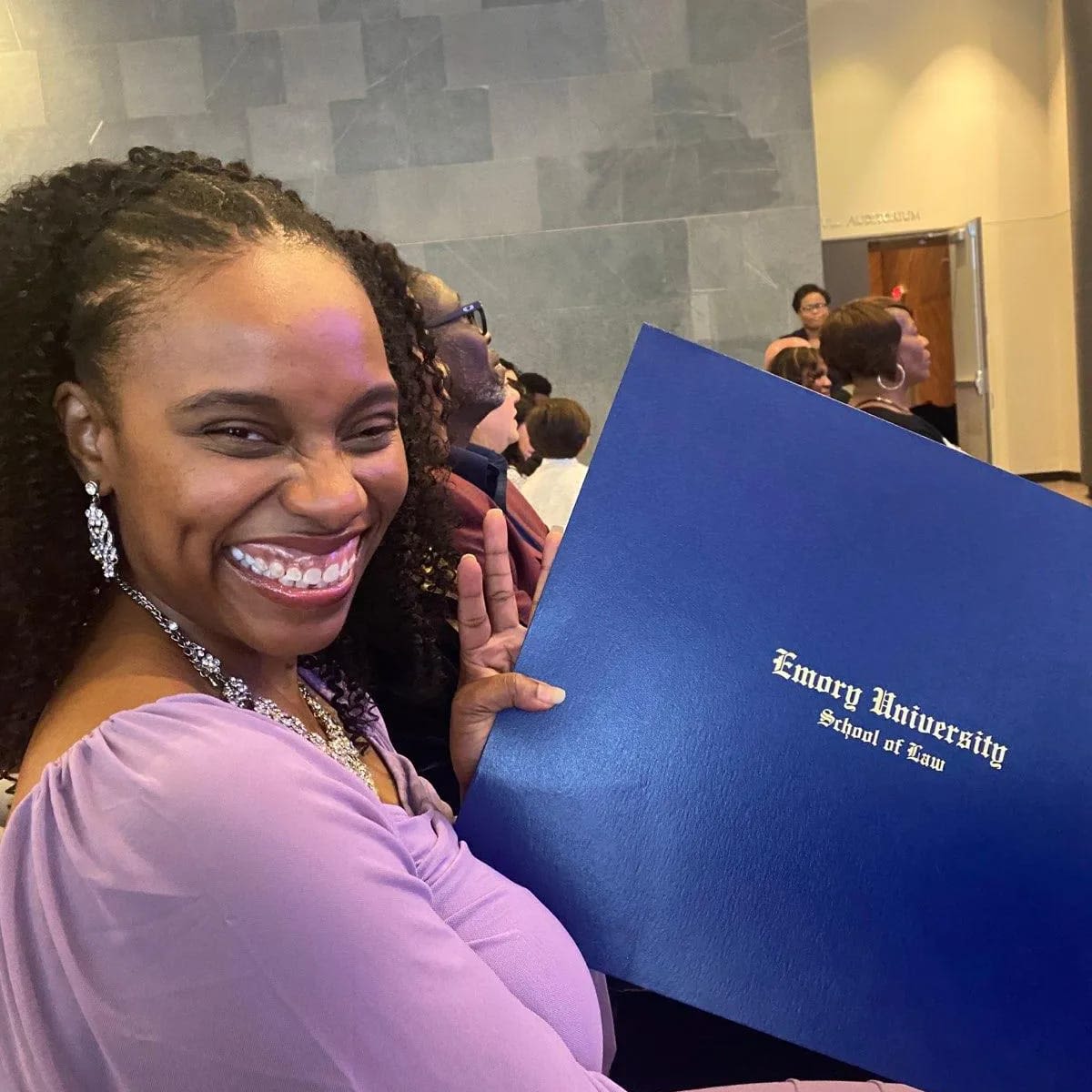 Phyllicia Thomas proudly displays her law degree.