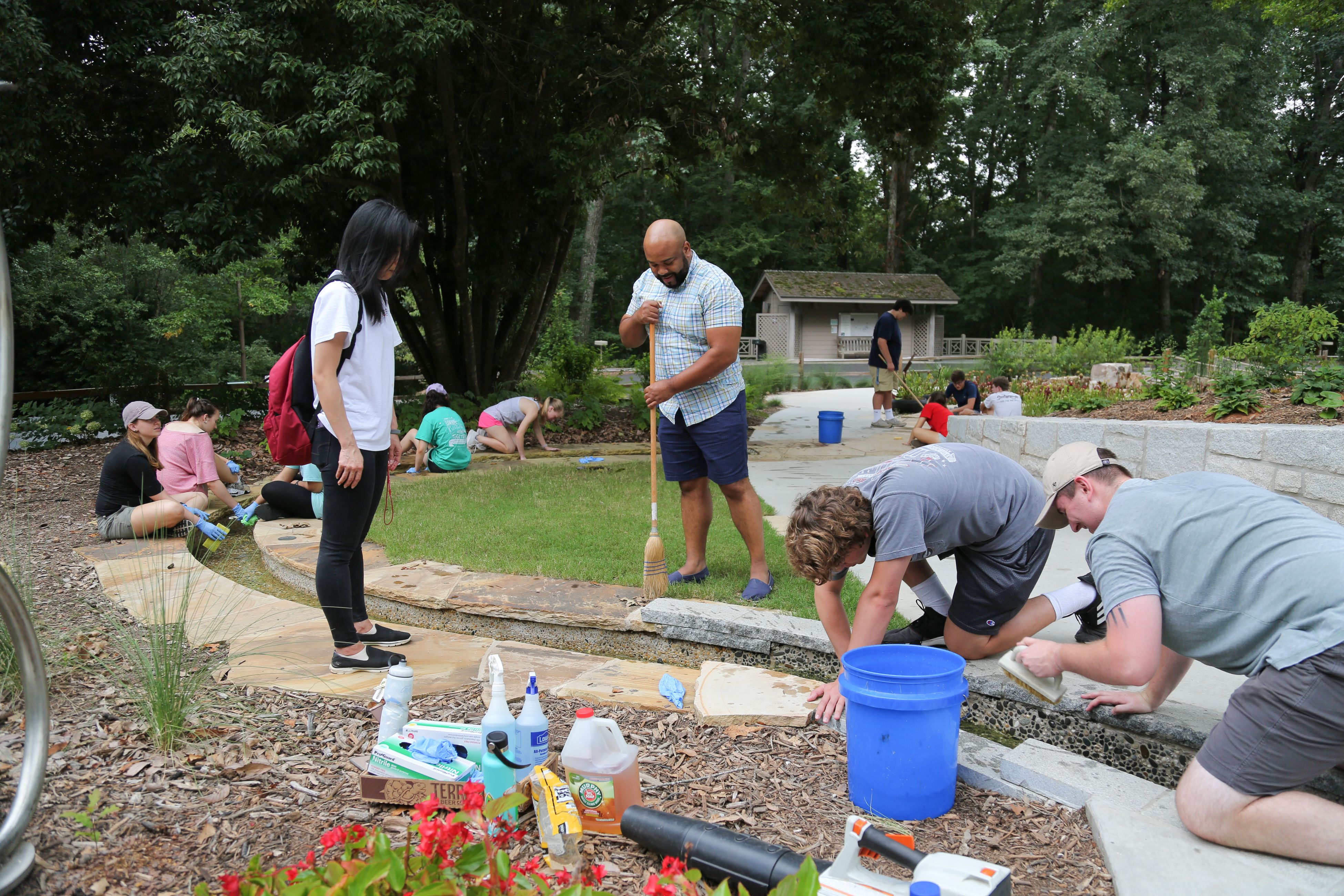 Students repair garden path