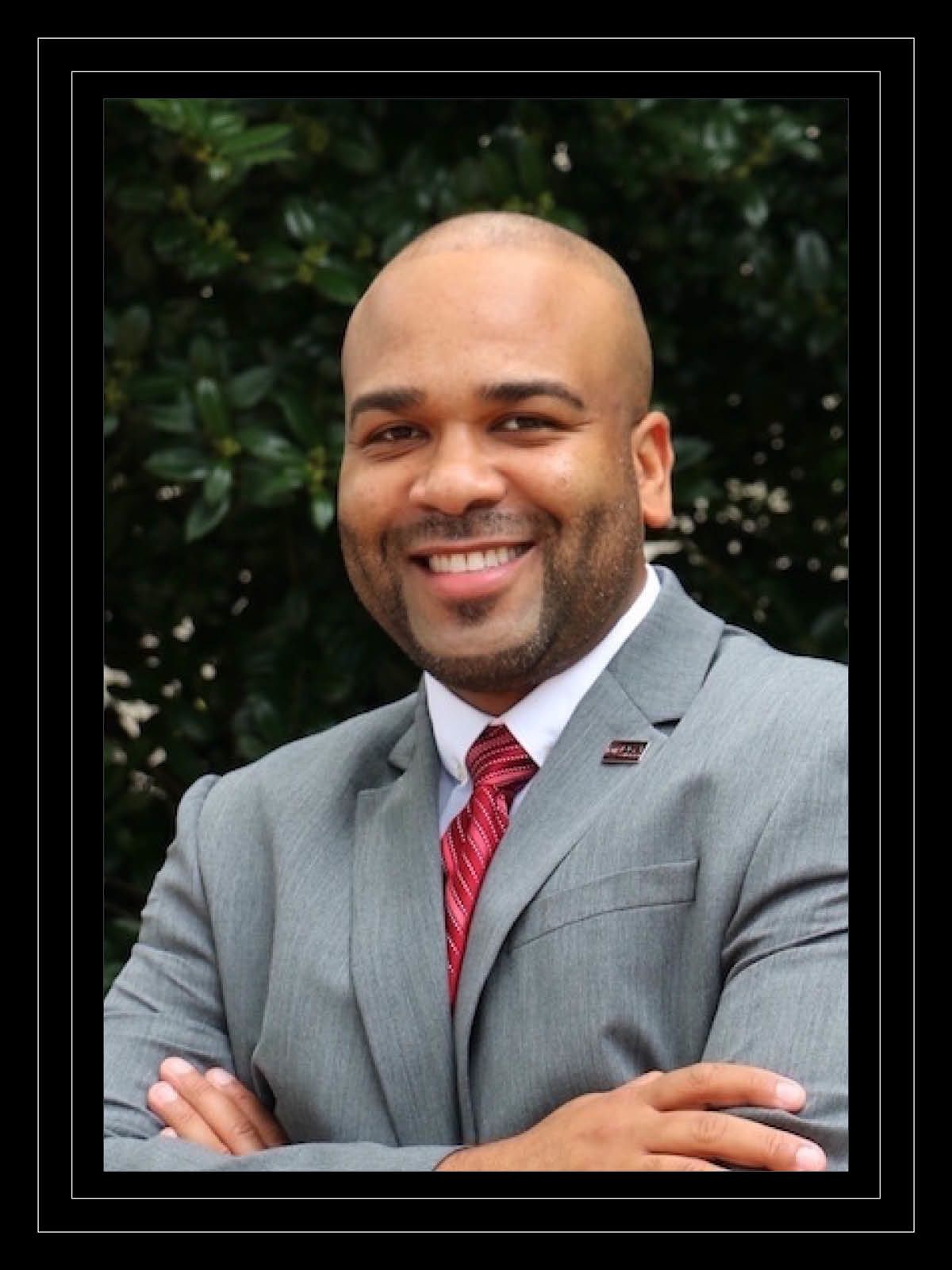Portrait of man in gray suit