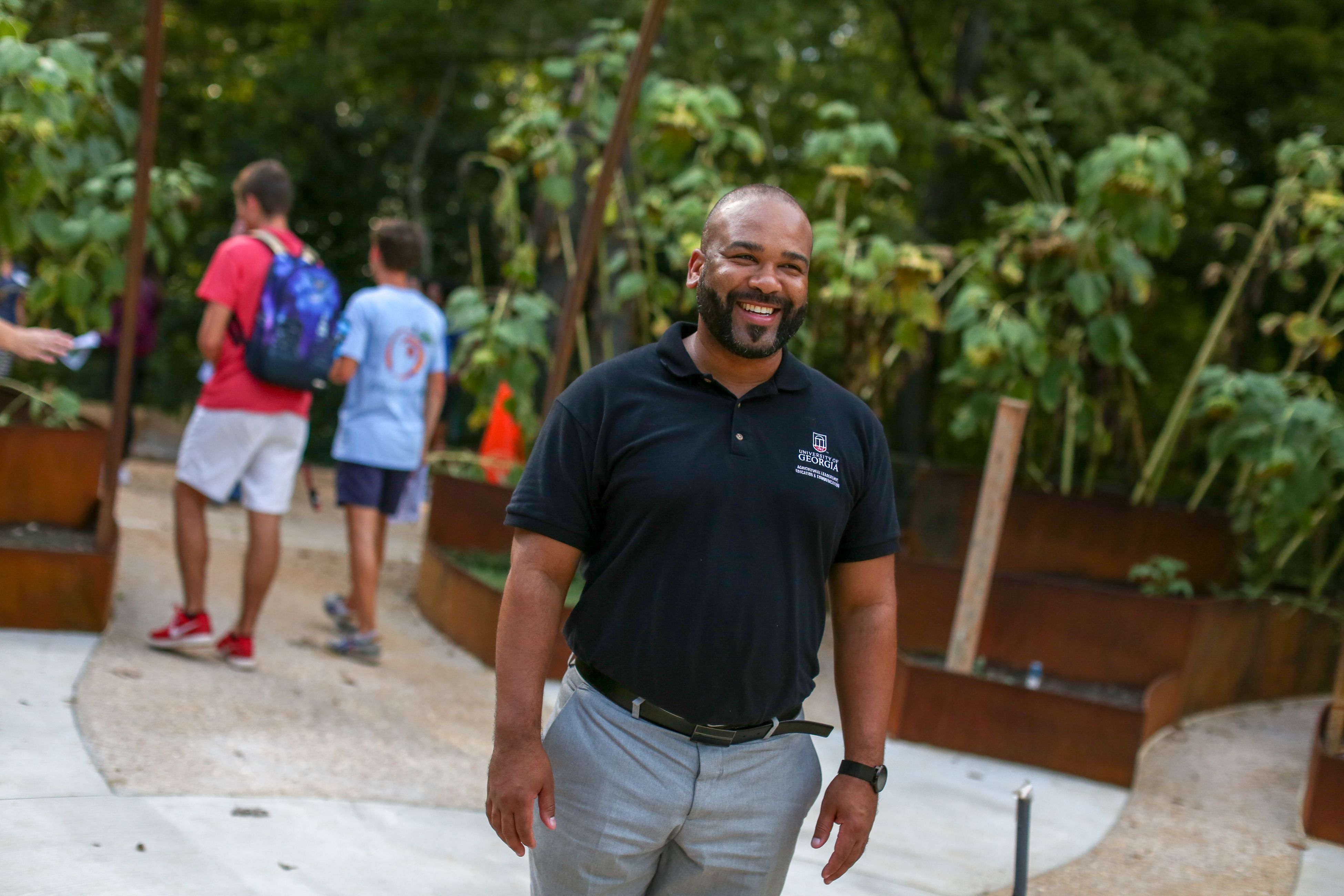 Man stands in a park garden