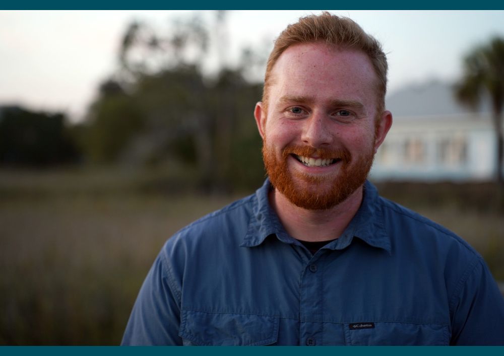 Grant Gorgas smiles with a low-country scene in the background
