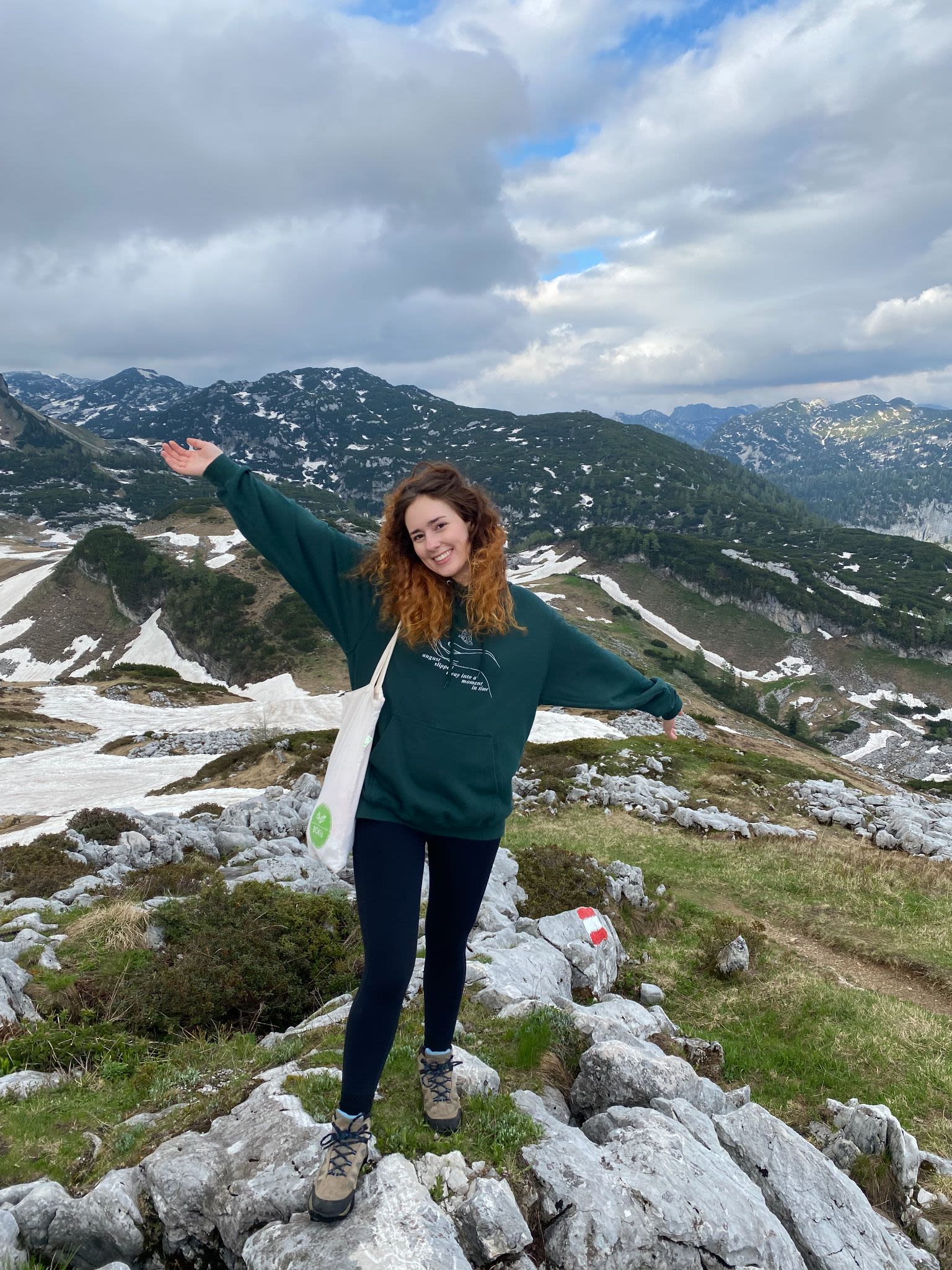 Swanger poses with a backdrop of mountains in Austria