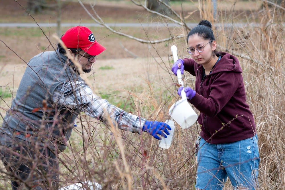 Issmat Kassem with a doctoral student in a field setting.