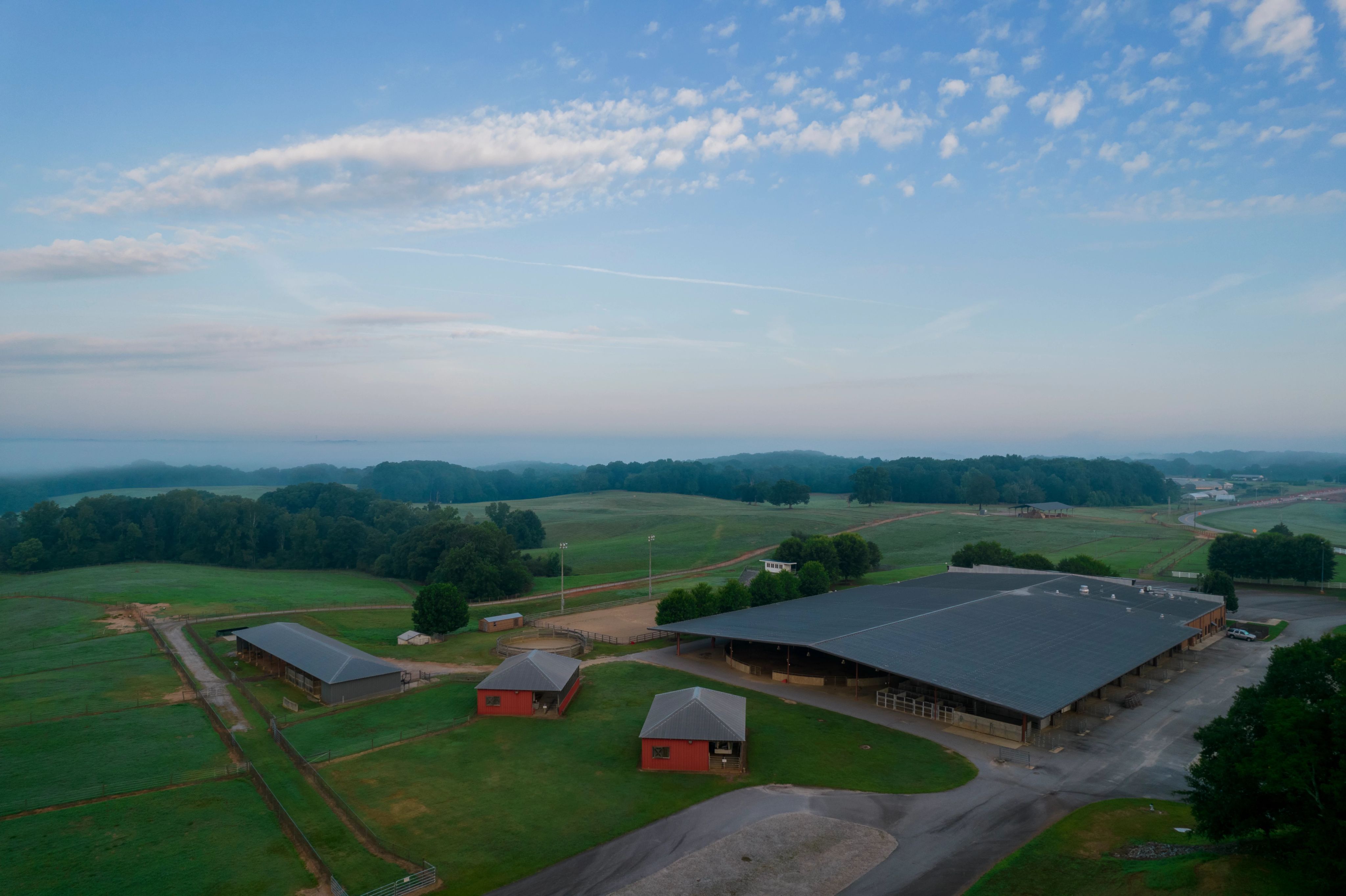 Overhead view of the Livestock Instructional Arena with fields in the background