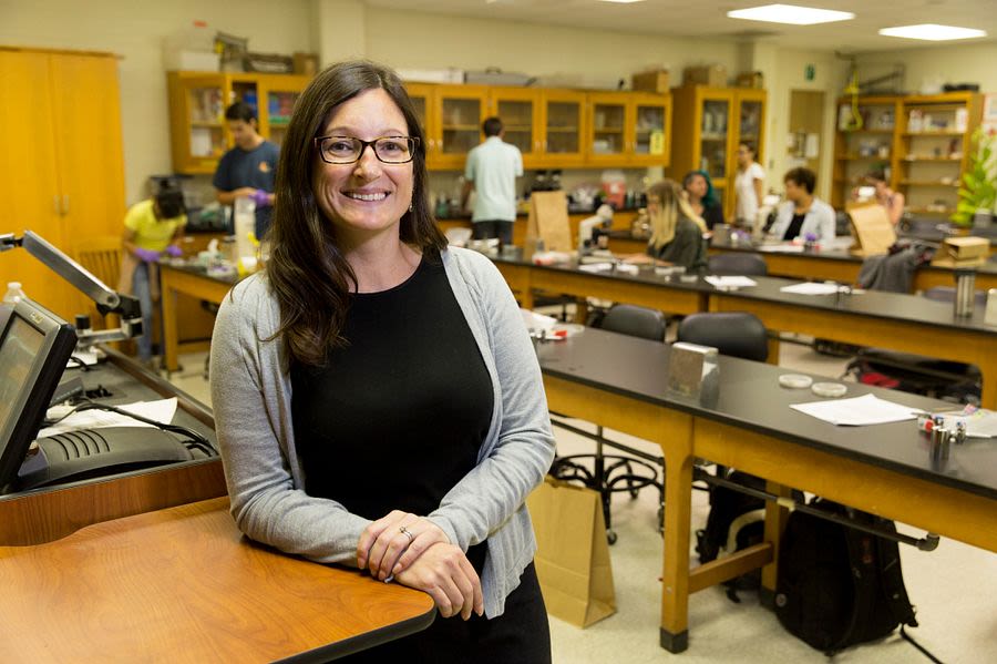 Brewer poses for a photo in her lab