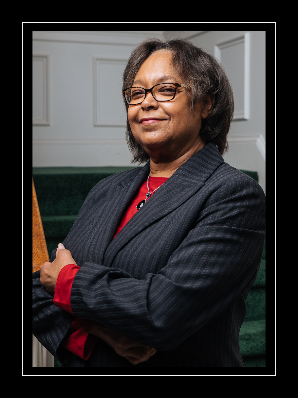 Linda Glanton Early smiles while standing in the staircase of her Byron, Georgia, home.