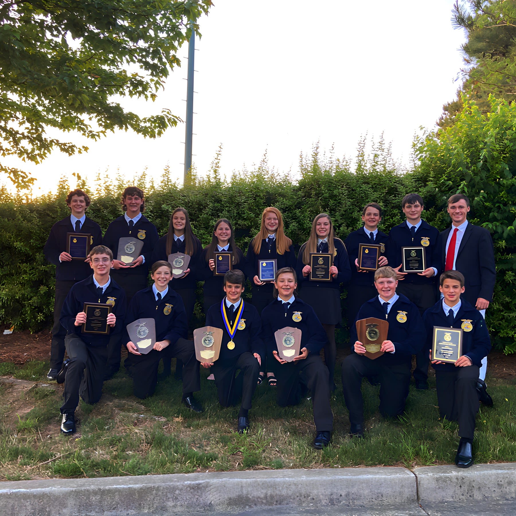 Lucas Brock poses with a group of FFA participants.