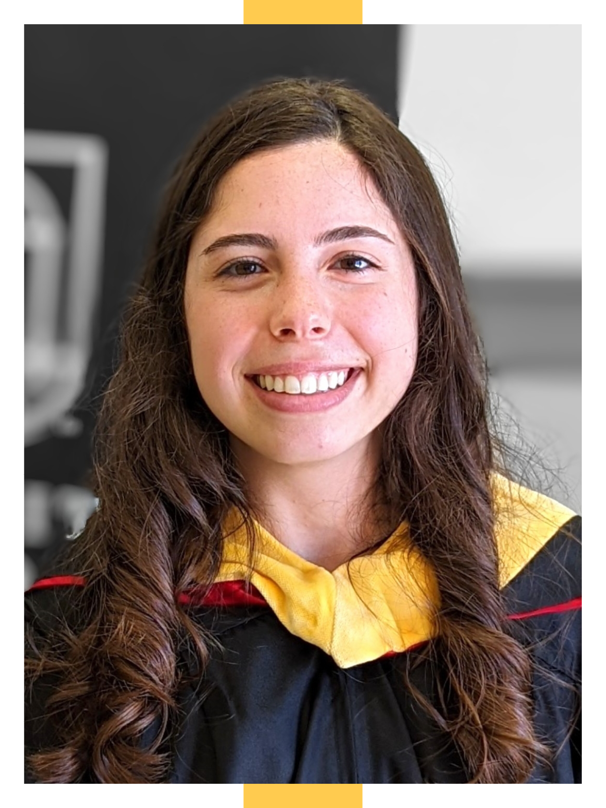 Kelvin Jimmy Awori stands on a sidewalk next to a railing in an autumnal scene, with orange and yellow leaves all around him