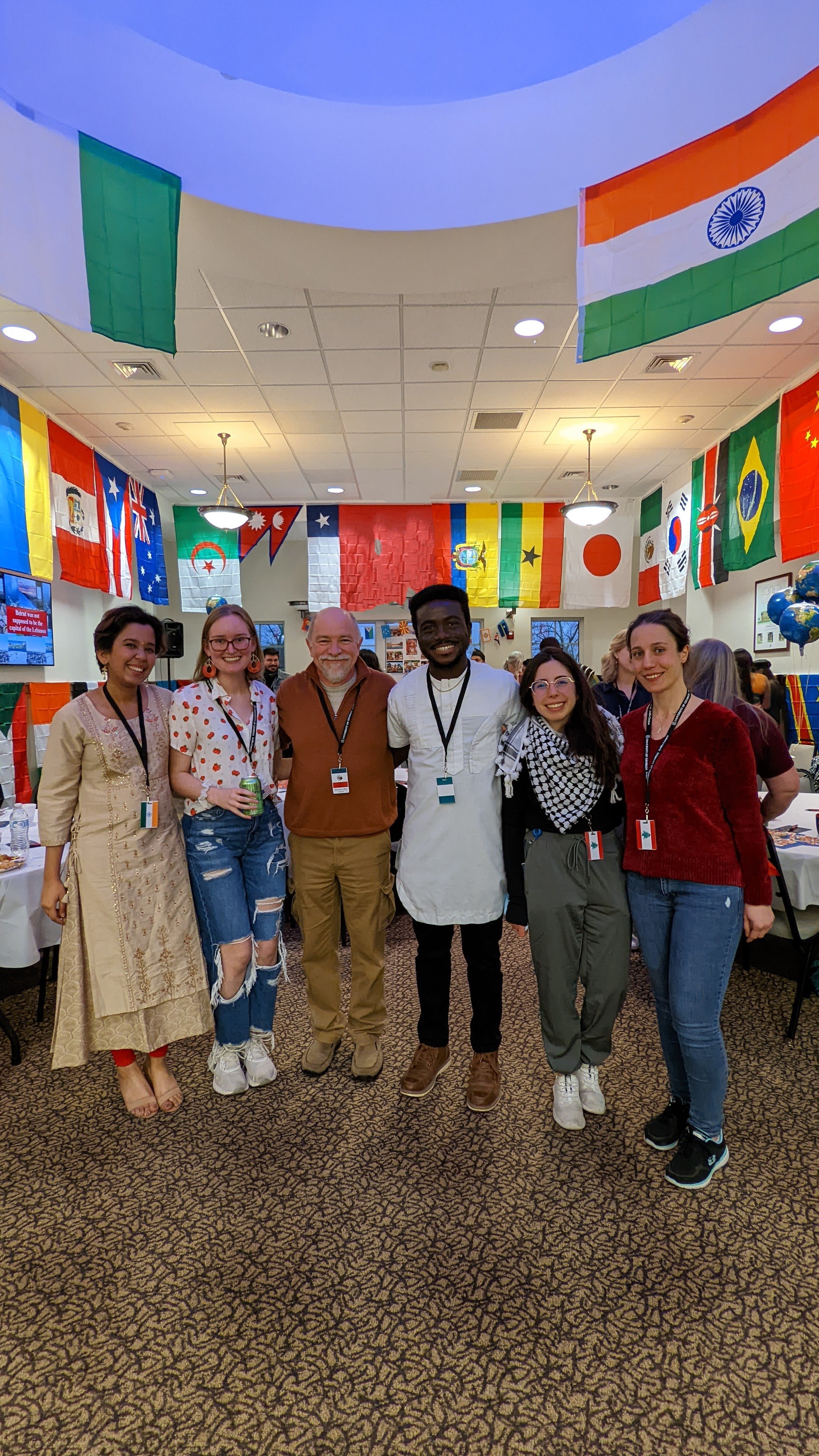 CFS students Revati Narwankar, Julianna Morris, CFS Director Francisco Diez, CFS students Ike Oguadinma, Rawane Radd and Nivin Nasser gather during the Taste of Nations event at UGA-Griffin