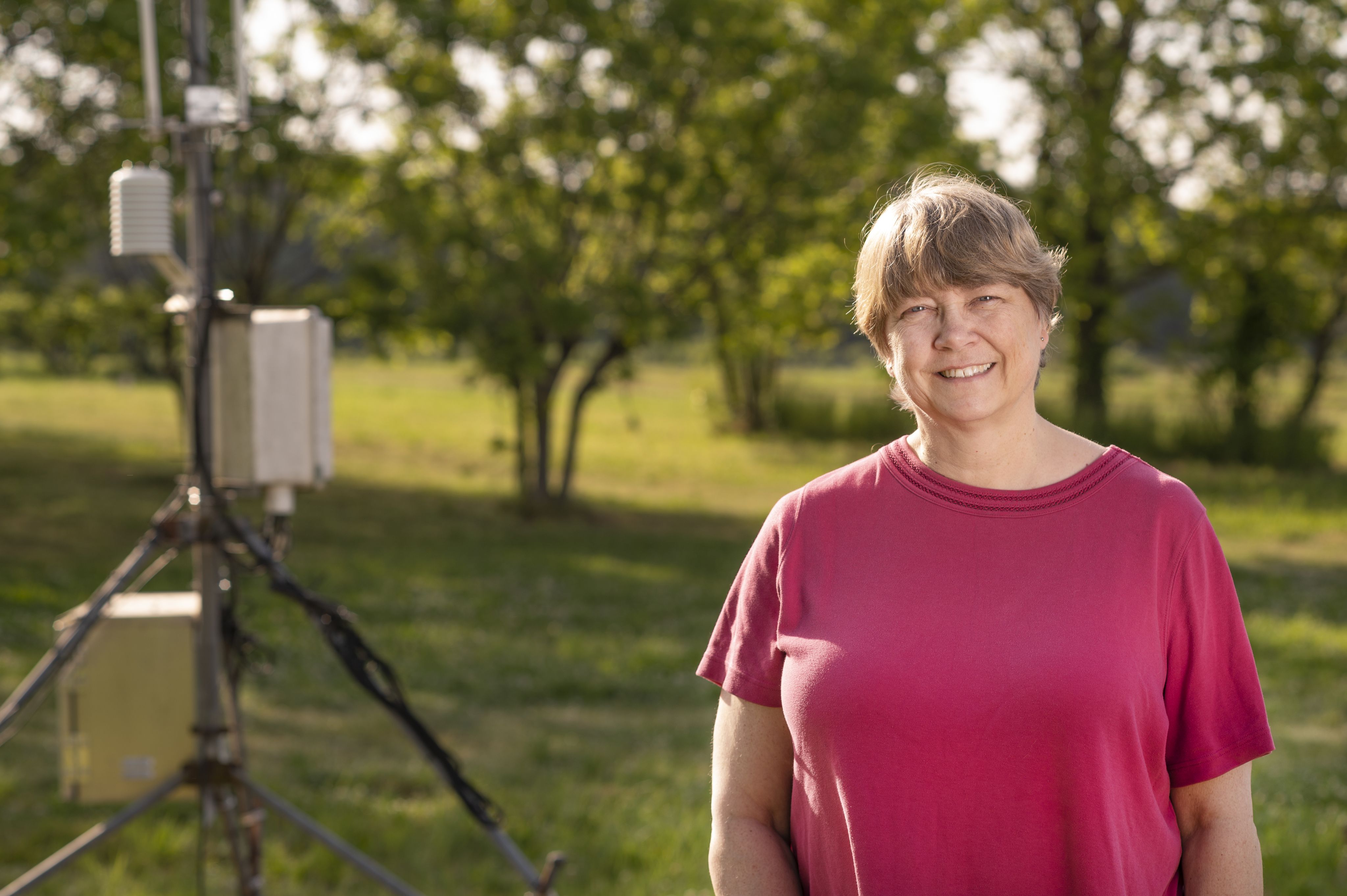 Agricultural climatologist Pam Knox monitors the effects of climate change on agriculture throughout the U.S. Here, she checks a weather monitoring system at Durham Horticulture Farm in Watkinsville, Ga. on April 8, 2022.