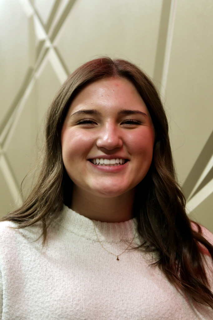 A close up of a woman smiling at the camera