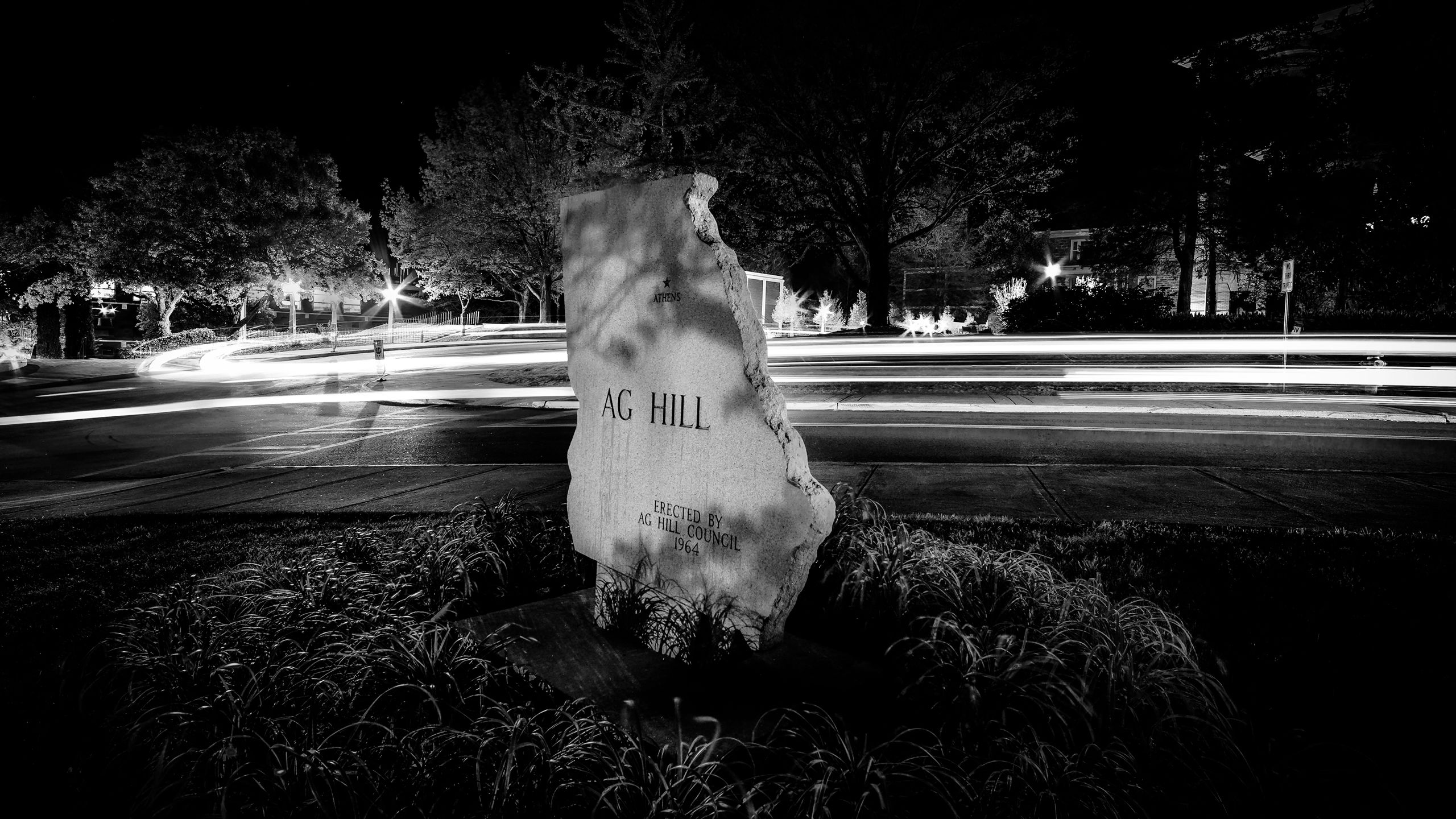 Black and white photo of a Georgia-shaped sign reading "Ag Hill."