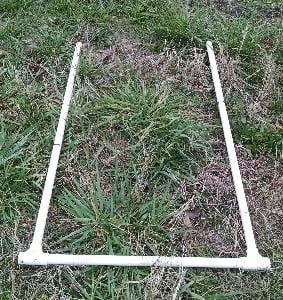 a U-shaped quadrat measuring device made from pvc pipes to mark an area 2ft wide by 2.5 ft long