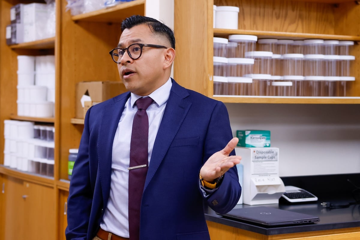 Kevin Mis Solval gesticulates while speaking in his lab on UGA's Griffin campus