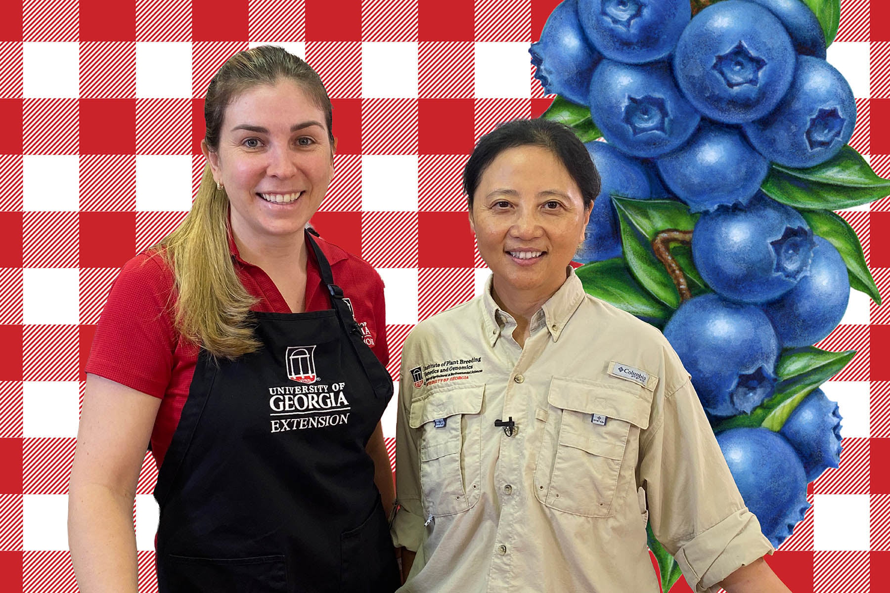 Two women standing together and smiling in front of blueberries and red checkered background