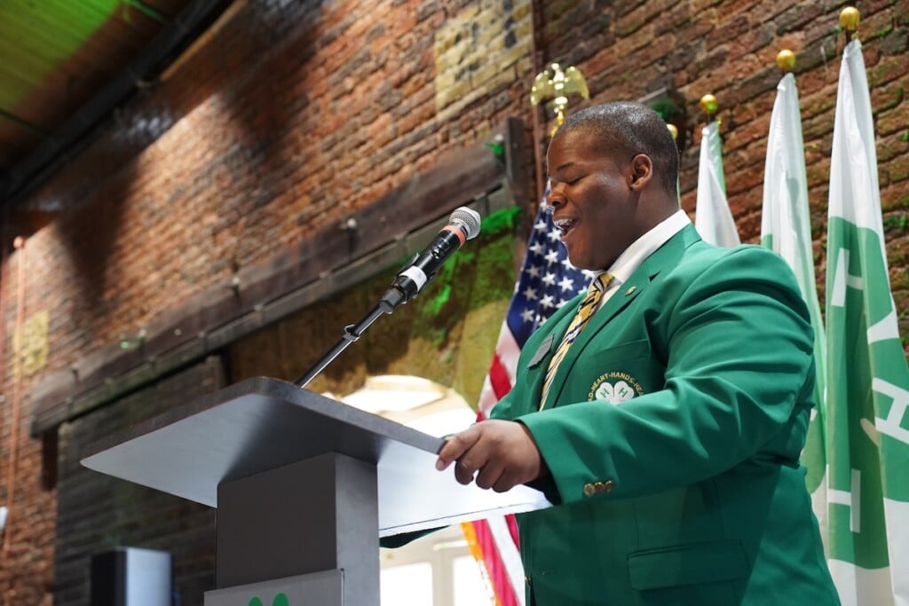 Kingston Ryals speaks at a lectern