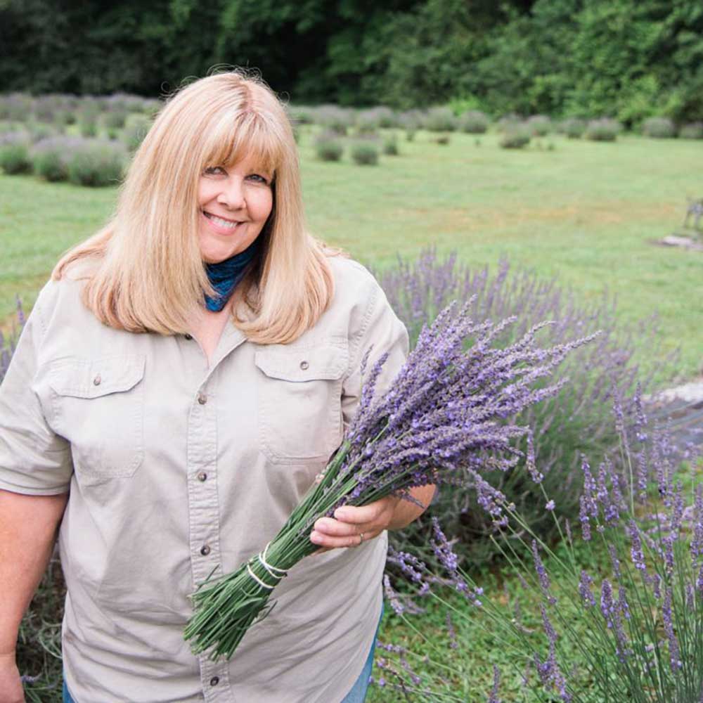 Tina Duffey holds a bouquet of lavender