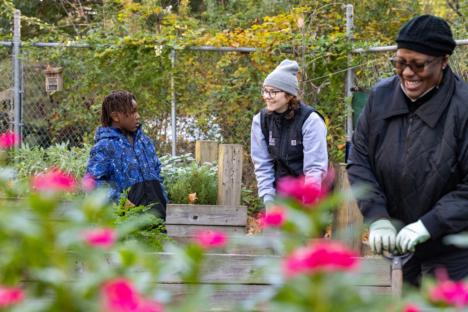 Volunteers work with UGA Extension agents during community garden cleanup day