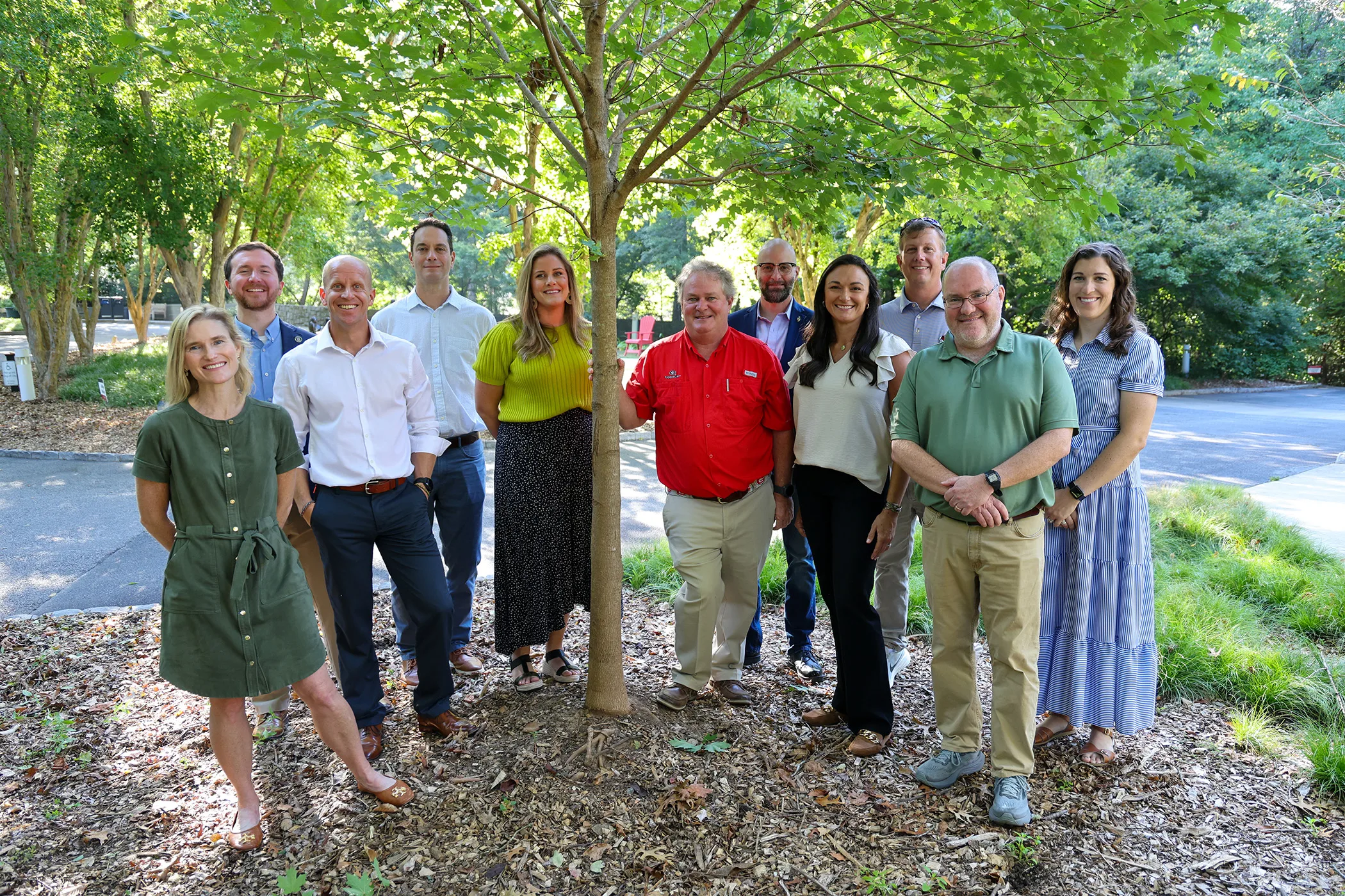 The Grow Back Project group stands under a tree in Augusta, Georgia