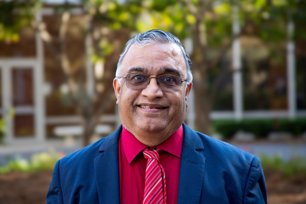Headshot of V.M. "Bala" Balasubramaniam in an outdoor setting.